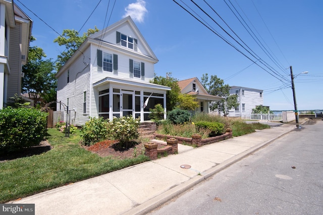 view of front of property with a sunroom