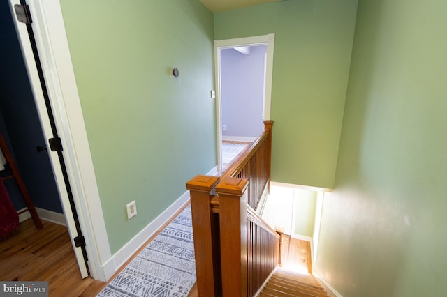 stairs featuring hardwood / wood-style flooring