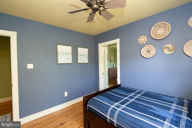 bedroom featuring hardwood / wood-style flooring and ceiling fan