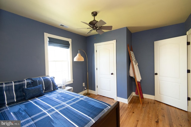 bedroom featuring ceiling fan and hardwood / wood-style floors