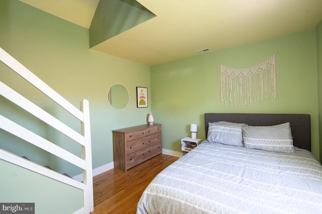 bedroom featuring wood-type flooring