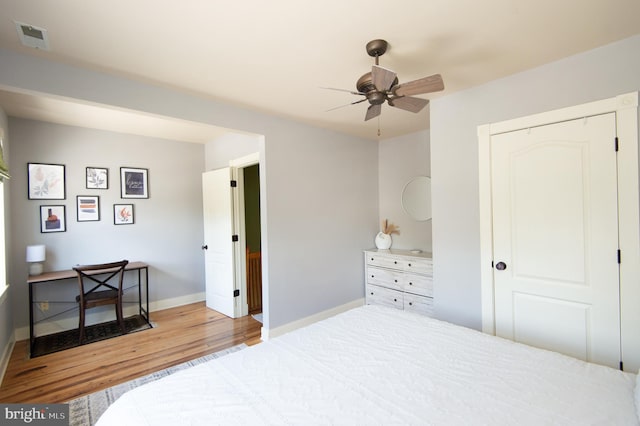 bedroom featuring hardwood / wood-style floors and ceiling fan