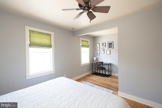 bedroom featuring hardwood / wood-style floors and ceiling fan