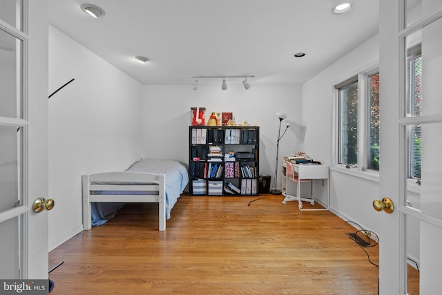 bedroom featuring light wood-type flooring