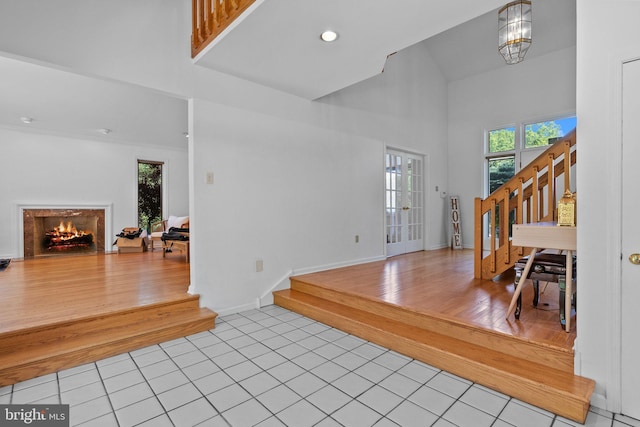 entrance foyer featuring light wood-type flooring and a notable chandelier