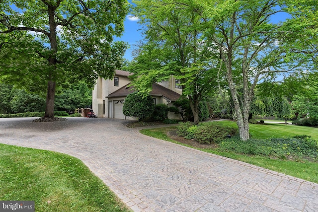 obstructed view of property featuring a garage