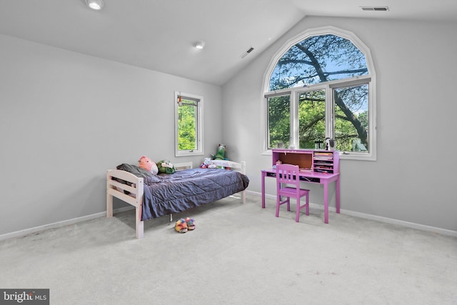 bedroom with light carpet and vaulted ceiling