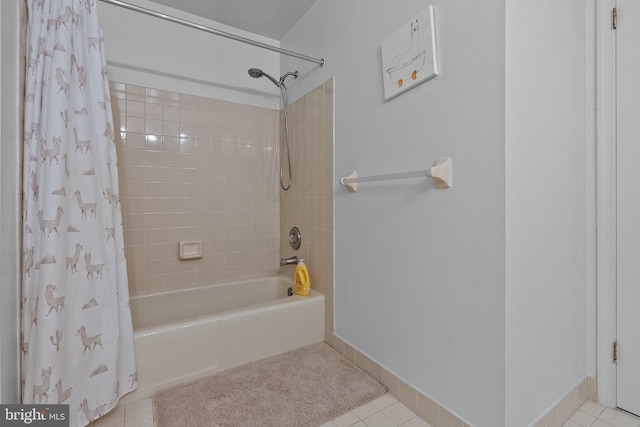 bathroom with tile patterned floors and shower / bath combination with curtain