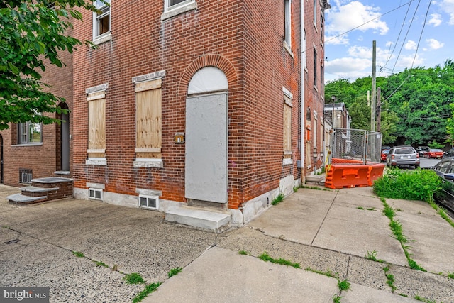 property entrance featuring a patio