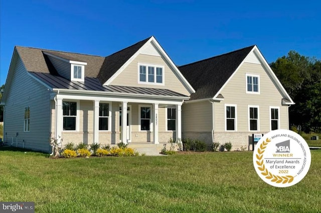 craftsman-style house with covered porch and a front yard