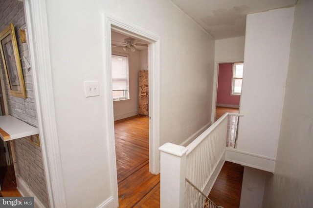 hall with wood-type flooring