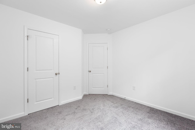 unfurnished bedroom featuring light colored carpet