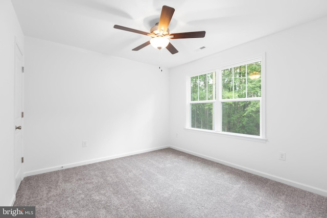 empty room with carpet floors and ceiling fan