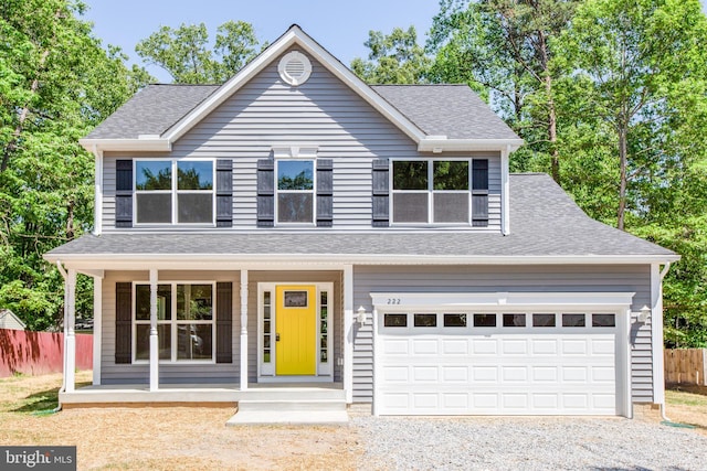 view of front facade with a porch and a garage