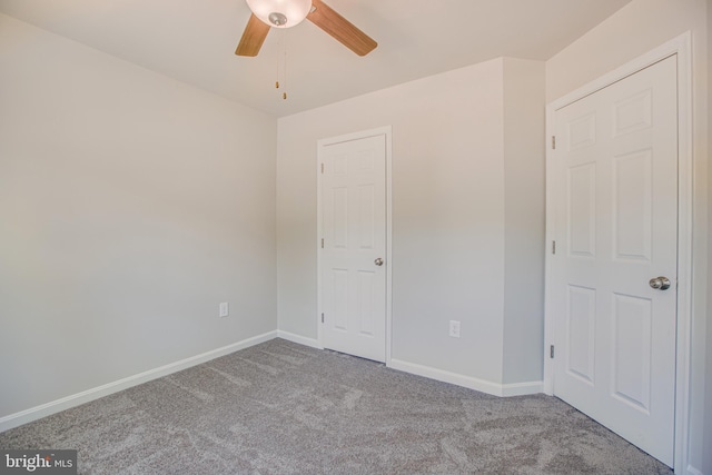 unfurnished bedroom with ceiling fan and light carpet