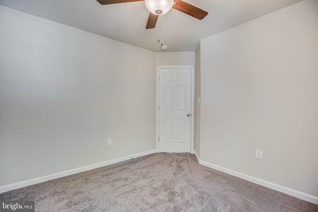 unfurnished room with ceiling fan and carpet floors