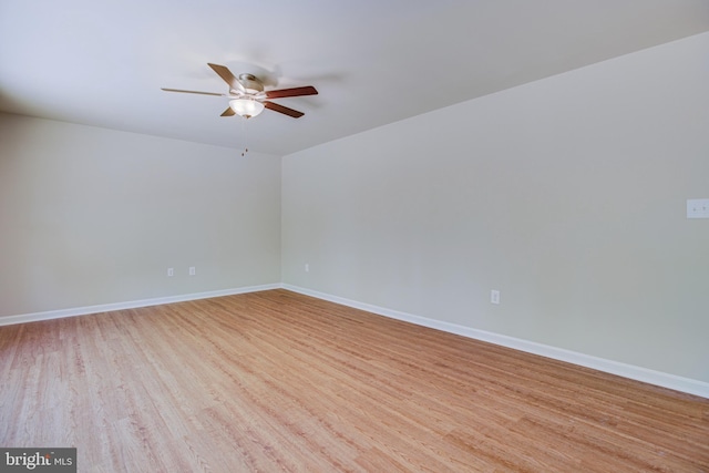 empty room featuring ceiling fan and light hardwood / wood-style floors