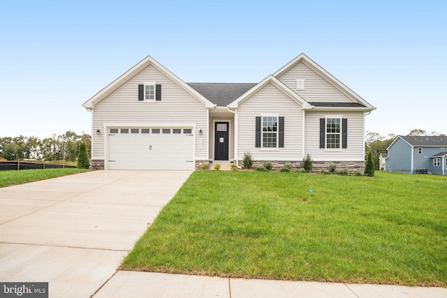 view of front of house featuring a front yard and a garage