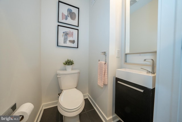 bathroom with tile patterned floors, vanity, and toilet