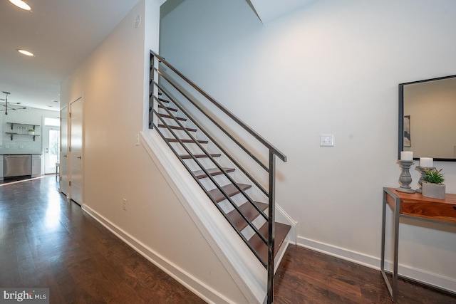 staircase featuring hardwood / wood-style floors