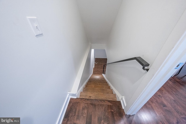 stairs with hardwood / wood-style floors