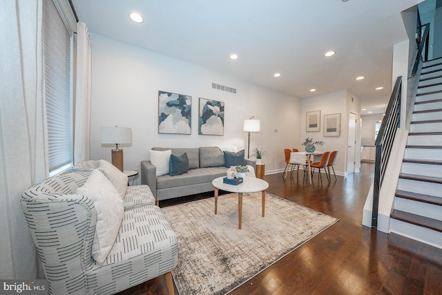 living room featuring dark wood-type flooring