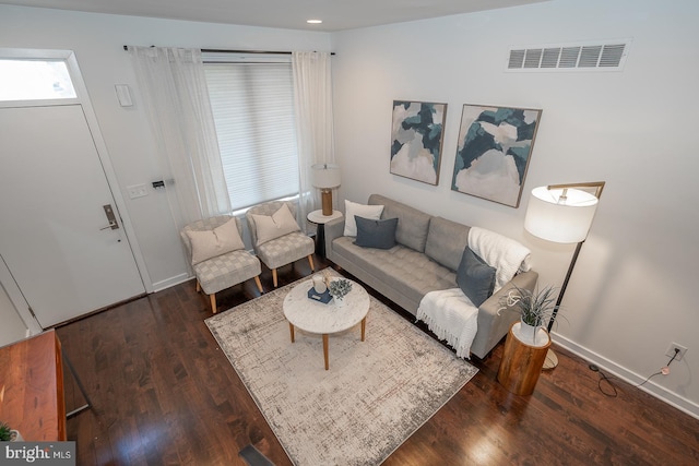 living room with dark hardwood / wood-style floors