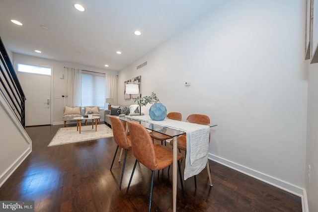 dining space with dark wood-type flooring