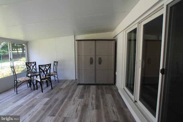 sunroom / solarium featuring lofted ceiling