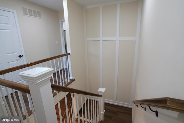 stairs with hardwood / wood-style floors