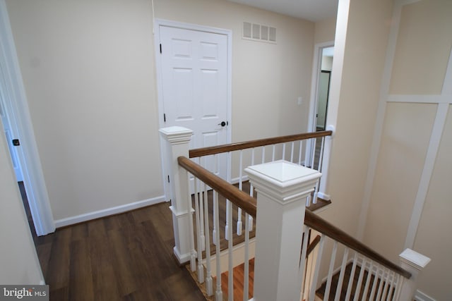 hall with dark wood-type flooring