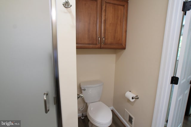 bathroom featuring toilet