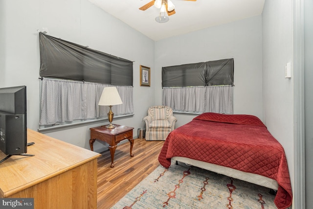 bedroom featuring wood-type flooring and ceiling fan