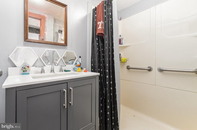 bathroom with vanity and curtained shower