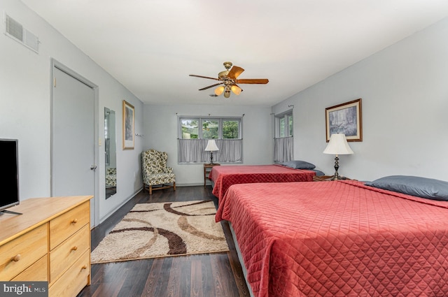 bedroom featuring ceiling fan and dark hardwood / wood-style floors