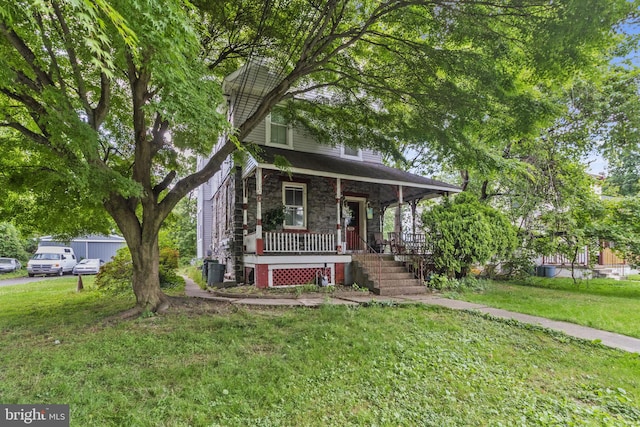 view of front facade with central air condition unit, a front lawn, and a porch