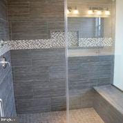 bathroom featuring walk in shower