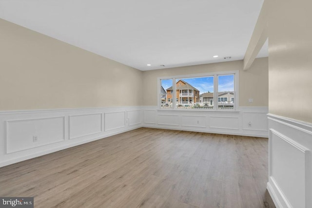 spare room featuring light hardwood / wood-style flooring