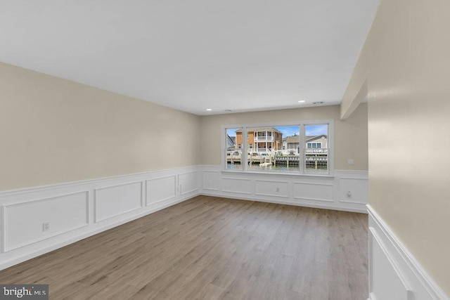 unfurnished room featuring light wood-type flooring