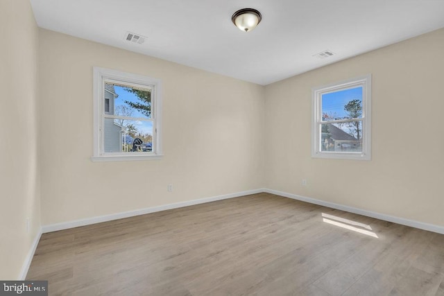 unfurnished room featuring light wood-type flooring