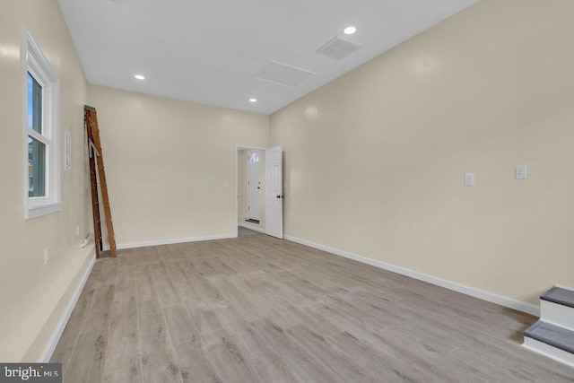 unfurnished room featuring light hardwood / wood-style floors