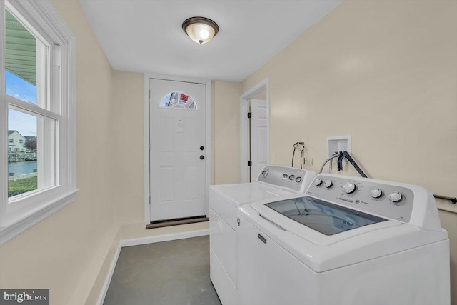 laundry area with washing machine and dryer