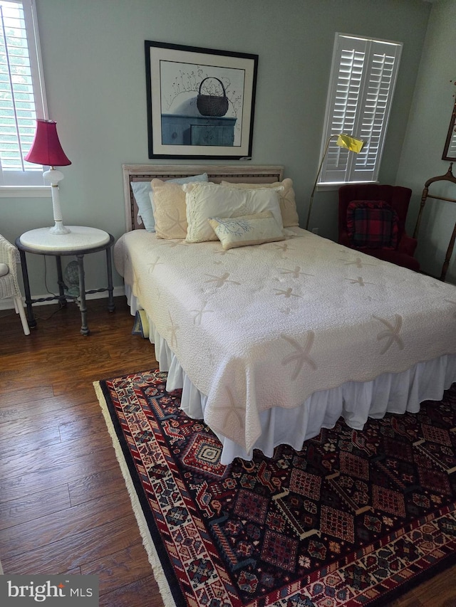 bedroom featuring dark hardwood / wood-style floors