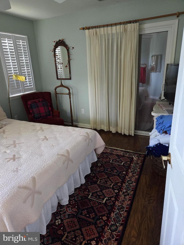 bedroom featuring dark hardwood / wood-style floors