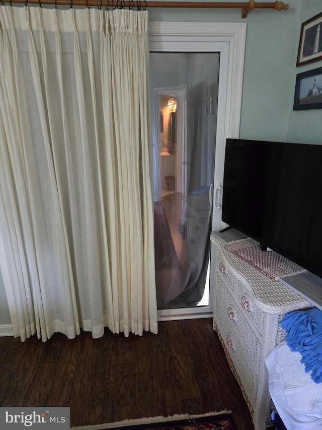 bedroom featuring dark hardwood / wood-style flooring