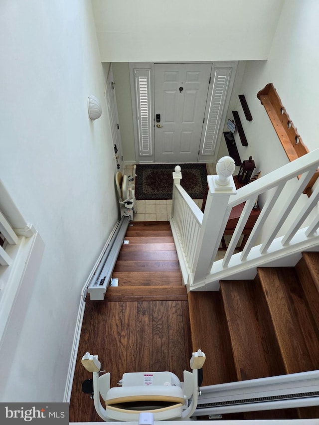 stairs with hardwood / wood-style floors