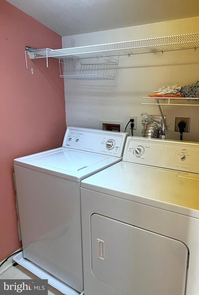 washroom featuring washer and dryer