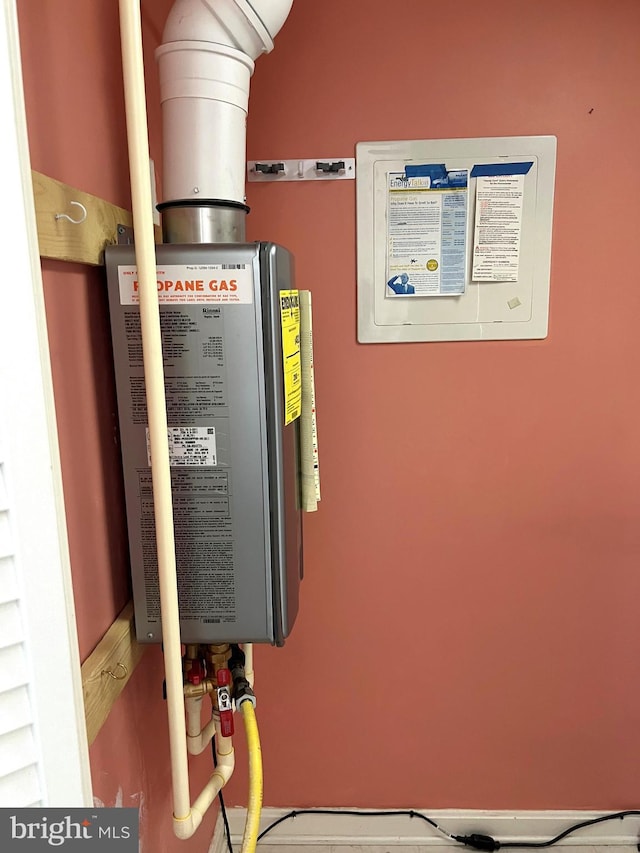 utility room with water heater