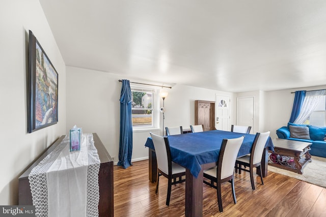 dining area featuring dark hardwood / wood-style flooring