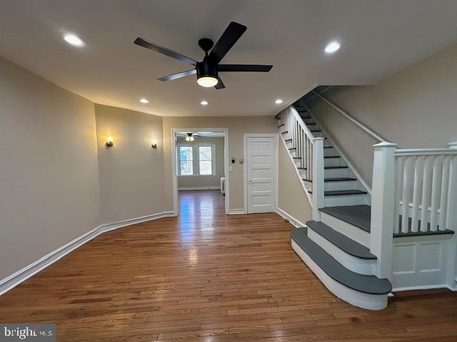 interior space with hardwood / wood-style flooring and ceiling fan